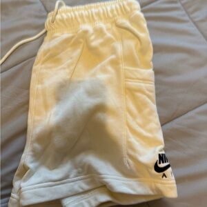 Cream Nike shorts
